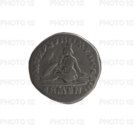 Denarius of Marcus Aurelius (121–180; Roman emperor 161–180). Obverse: Head of Marcus Aurelius with a laurel wreath to the right, inscribed 'ONIN AVG - ARMENIACVS'. Reverse: Armenia personified, seated to the left in a short robe, trousers and pointed cap; she supports her head with her right hand, rests her left hand on a bow and quiver, with a shield and a standard (vexillum) in front; inscription 'PM TR P XVIII IMP II COS III' and episode mark 'ARMEN.' Date: 163–164. Rome, Roman Empire (27 BC–476). Coin; weight 3.1 g; diameter 16.5–17.0 mm; axis 0°.