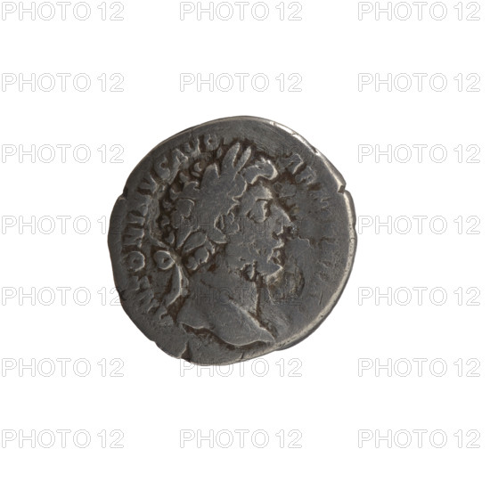Denarius, Marcus Aurelius (121–180; Roman emperor 161–180) — obverse: Head of Marcus Aurelius with a laurel wreath facing right, inscription ANTONINVS AVG; reverse: Armenia personified in a short robe, trousers and a pointed cap sitting left, supporting her head with her right hand, resting her left on a bow and a quiver, with a shield and a standard (vexillum) in front, inscription PM TR P XVIII IMP II COS III and episode ARMEN.; weapons: quivers, bows; iconography: personifications, vexillum, shields; date: 163–164; Roman Empire (27 BC–476), Rome; coin; diameter 16.0 mm; weight 2.80 g; axis 180°.