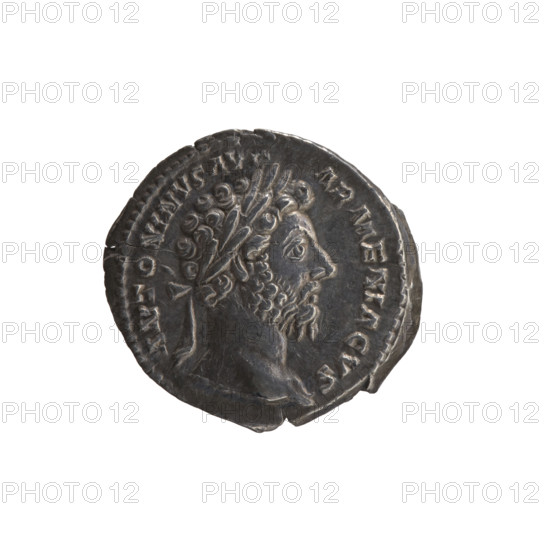 Denarius of Marcus Aurelius (121–180; Roman emperor 161–180), 163–164 CE. Obverse: Head of Marcus Aurelius with laurel wreath facing right, inscription ANTONINVS AVG - ARMENIACVS. Reverse: Mars standing right, holding a spear with the head down in his right hand and resting his left hand on a shield; inscriptions PM, RP XVIII - IMP II COS, II. Roman Empire (27 BC–476), Rome. Coin; silver; diameter 17.0–19.0 mm; weight 3.35 g; axis 180°.