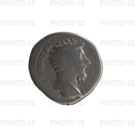 Denarius; obverse: Head of Marcus Aurelius without a cap facing right, legend 'ANTONINVS AVG' with 'S' all around; reverse: Mars standing right, holding a spear with the head down in his right hand, resting his left hand on a shield, legend 'PM TR P XVIII - IMP II COS III' all around. Issuer: Marcus Aurelius (121–180; Roman emperor 161–180). Subject/iconography: Marcus Aurelius; Mars (Roman deity); shields; spears. Date: 163–164. Place: Rome, Roman Empire (27 BC–476). Material/function: coin (denarius). Dimensions: diameter ~16.5–17.0 mm, weight 2.90 g, axis 0°.