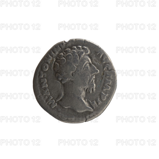 Denarius of Marcus Aurelius (121–180; Roman emperor 161–180), 163–164. Obverse: Head of Marcus Aurelius, drapery on left shoulder, facing right, inscription M ANTONINVS - AVG IMP II. Reverse: Minerva stands left, holds a twig in her right hand, supports a round shield with a spear leaning against it in her left hand, inscription TR P XVIII - COS III. Roman Empire (27 BC–476), Rome. Coin; diameter 17.5 mm; weight 2.56 g; axis 195°.