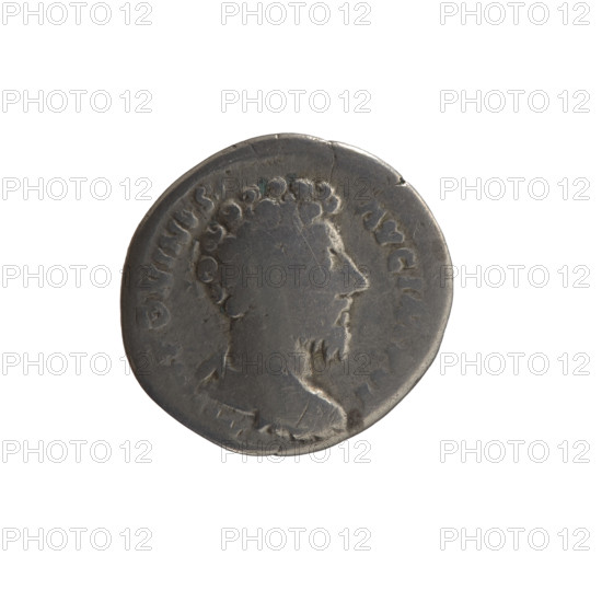 Denarius of Marcus Aurelius (121–180; Roman emperor 161–180), c. 163–164. Obverse: Bust of Marcus Aurelius bareheaded, in armor, right, legend TONINVS - AVG IMP II. Reverse: Minerva stands left, holds a branch in her right hand, supports a round shield with a spear in her left hand, legend TR P XVIII - C, S III. Roman deities; iconography includes shields and spears. Roman Empire (27 BC–476). Coin; diameter ~17–18 mm, weight 3.45 g, axis 180°.