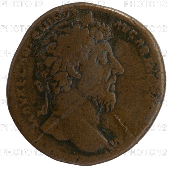 Sestertius, Marcus Aurelius (121–180; Roman emperor 161–180) (issuer). Obverse: Head of Marcus Aurelius with laurel wreath facing right, inscription M AVREL ANTONINVS - AVG ARM, all around. Reverse: Victoria standing right, holding a trophy in both hands; in front of her sits the personification of Armenia, inscription VICT AVG TR P XVIII - IMP II C, all around, in SC fields. Date: 163–164. Roman Empire (27 BC–476). Rome. Coin. Diameter 30.0–31.5 mm; weight 24.30 g; axis 0°.