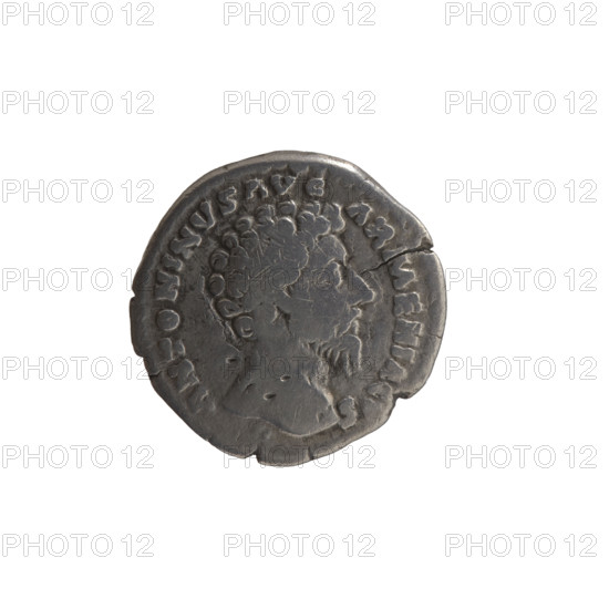 Denarius of Marcus Aurelius (121–180; Roman emperor 161–180). Obverse: Head of Marcus Aurelius uncovered, facing right; inscription ANTONINVS AVG - ARMENIAC, S all around. Reverse: Mars standing right, holding a spear in his right hand, resting his left on a shield standing on the ground; inscription PM TR P XIX - IMP II COS III all around. Date: 164–165. Place: Rome, Roman Empire (27 BC–476). Material/function: coin. Diameter: 17.0 mm. Weight: 2.60 g. Axis: 0 degrees. Subjects/icons: Roman deities—Mars; iconography of Marcus Aurelius; shields, spears.