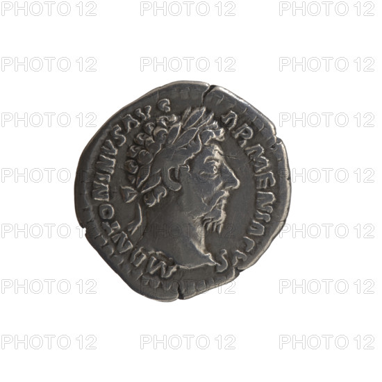 Denarius, Marcus Aurelius (121–180; Roman emperor 161–180), issuer Marcus Aurelius. Obverse: head of Marcus Aurelius in a laurel wreath to the right, legend M ANTONINVS AVG - ARMENIACVS. Reverse: Roma seated on a shield to the left, holding a small figure of Athena (palladium) in her outstretched right hand and a spear in her left, legend PM TR P XIX - IMP III COS III. Date: 165. Roman Empire (27 BC–476), Rome. Coin; diameter 18.0–18.5 mm, weight 3.00 g, axis 180°. Subjects/personifications: Roma, palladium (attribute); shields, spears.