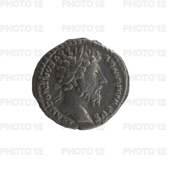 Denarius of Marcus Aurelius (121–180; Roman emperor 161–180), 165. Obverse: Head of Marcus Aurelius in a laurel wreath to the right, legend M ANTONINVS AVG - ARMENIACVS. Reverse: Roma sitting on a shield to the left, holding in her right outstretched hand a figure of Athena (palladium) and a spear in her left, legend PM TR P XIX - IMP III COS III. Personifications: Roma; attributes: shields, palladium, spears. Roman Empire (27 BC–476), Rome. Coin: silver, diameter 17.5 mm, weight 3.15 g, axis 15°.
