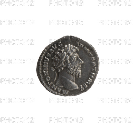 Denarius, Marcus Aurelius (121–180; Roman emperor 161–180), issuer: Marcus Aurelius. Obverse: Head of Marcus Aurelius in a laurel wreath facing right, legend M ANTONINVS AVG - ARM PARTH MAX. Reverse: Victoria stands half-naked frontally, head turned right, holding a palm branch in her right hand and fastening a shield inscribed VIC PAR to a tree with her left hand, legend TR P XX - IMP IIII COS III. Date: 166. Roman Empire (27 BC–476). Coin. Diameter 18.0–18.5 mm; weight 3.10 g; axis 180 degrees.