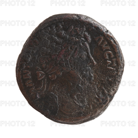 Sestertius of Marcus Aurelius (121–180; Roman emperor 161–180). Obverse: Head of Marcus Aurelius with laurel wreath facing right, inscription M ANTO•VS - AVG T, XV all around. Reverse: Victoria standing half-naked to the right, fastening a shield inscribed VIC GER to a tree, palms, shields, with letters I, V, I in fields. Iconography: Marcus Aurelius, Victoria (mythology). Date: 170–171. Roman Empire (27 BC–476), Rome. Coin (bronze); diameter c. 30–31 mm, weight 31.70 g, axis 0°.
