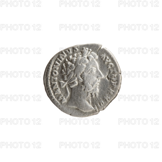 Denarius of Marcus Aurelius (121–180; Roman emperor 161–180), issuer Marcus Aurelius — iconography: shields, spears, trophies, prisoners. Obverse: head of Marcus Aurelius with laurel wreath to right, legend M ANTONINVS - AVG TR P XXVII. Reverse: Germanic prisoner sitting right under a trophy, legend IMP VI - COS III. Date: 172–173. Roman Empire (27 BC–476). Rome. Coin; diameter 17.0–19.0 mm, weight 2.85 g, axis 0°.