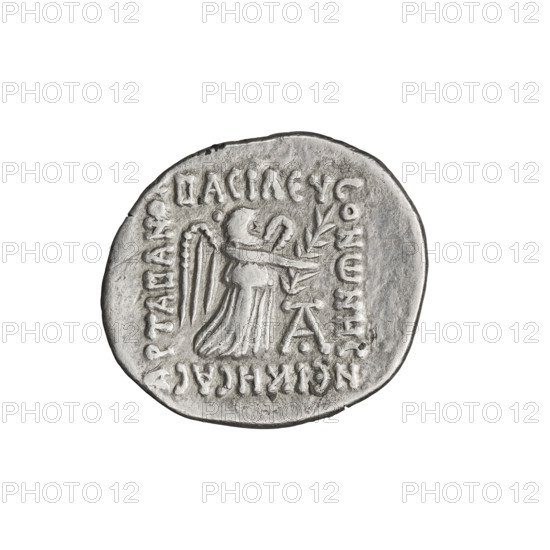 Drachma of Vonones I (8–11 CE). Obverse: diademed head of Vonones I facing left. Reverse: Nike standing facing right, palm in outstretched right hand, wreath in left hand. Parthian Kingdom, Iran. Coin; diameter 18.0–21.0 mm, weight 3.60 g. Subjects/themes: wreaths, Nike, diadems, heads.