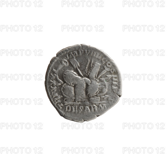 Denarius of Marcus Aurelius (121–180; Roman emperor 161–180), obverse: head of Marcus Aurelius with laurel wreath facing right, legend 'M ANTONINVS AVG'; reverse: pile of war spoils — armor, shields, spears, trumpet (karnyx), standard (vexillum) and helmet, with legend 'TR P XXXI – IMP VIIII COS III PP' (in the episode DE SARM, 176–177). Iconography: spoils of war, carnyxes, spears, shields, armor; reference to Sarmatians. Roman Empire (27 BC–476). Coin: diameter 18.0 mm, weight 2.80 g, axis 0°.