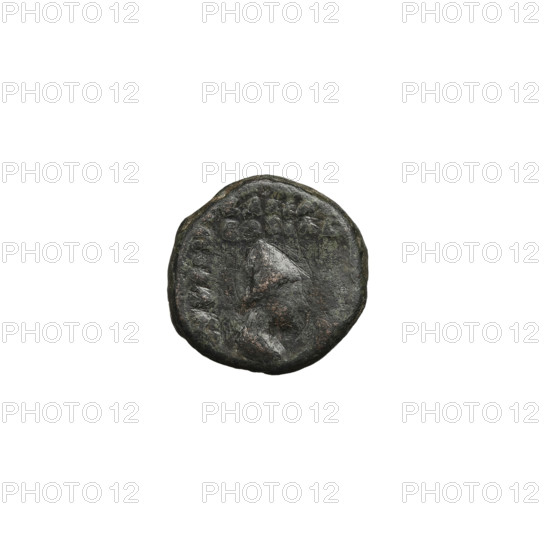 Bronze coin of Pacorus II (77–109). Obverse: head of Pacorus II wearing a diadem and tiara, facing left. Reverse: male head in high headdress, facing right. Parthian Empire, Iran. Coin diameter 9.5 × 10.0 mm; weight 1.65 g.