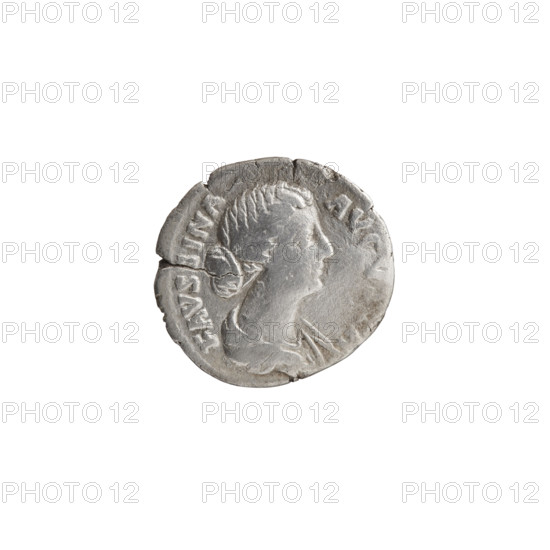 Denarius depicting Faustina the Younger (ca. 130–176; Roman empress 161–176) and Marcus Aurelius (121–180; Roman emperor 161–180) as issuers; obverse: bust of Faustina II in drapery facing right with inscription FAVSTINA · AVGV; reverse (inverted): Cybele (Magna Mater) in a turret crown seated left, holding a branch in her right hand and resting her left on a drum, with a seated lion below and inscription RI · MAGNAE; iconography includes ancient deities, drums, branches, and lions; dated 161–176, Roman Empire (Rome); coin: diameter 16.5–17.5 mm, weight 2.80 g, axis 15°.