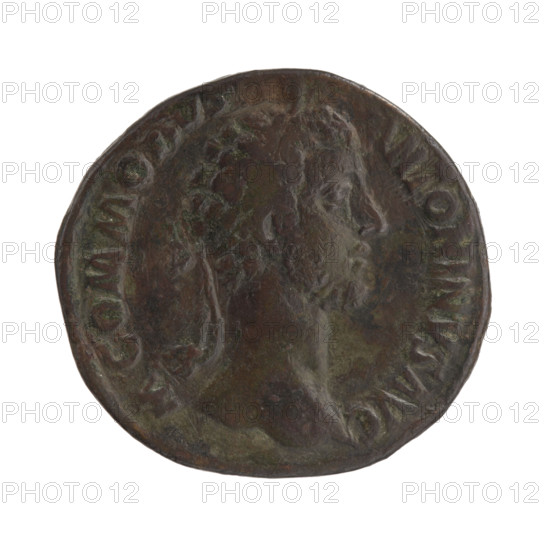 Sestertius of Commodus (r. 177–192). Obverse: Head of Commodus in a laurel wreath facing right, legend M COMMODVS - ANTONINVS AVG. Reverse: Libertas standing left, holding a liberation cap (pileus) in her right hand and a staff (vindicta) in her left, legend P VI IMP IIII COS III P, in SC fields. Date: 181. Roman Empire; Rome. Coin; diameter 29.5–31.5 mm, weight 20.01 g, axis 0°. Iconography: personifications — Commodus, Libertas; attributes — pileus, vindicta.