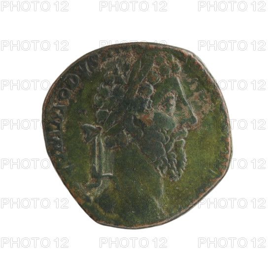 Sestertius of Commodus (161–192; Roman emperor 177–192). Obverse: Head of Commodus in a laurel wreath to the right, inscription 'M COMMODVS ANTOG PIVS B' (all around). Reverse: Victoria half-naked seated on shields to the right, holding a stylus in her right hand and with her left hand holding a shield resting on her knees; inscriptions 'P–M' (all around), 'VICT BRIT' in section, 'SC' in fields. Date: 184–185. Roman Empire (27 BC–476), Rome. Coin (sestertius): diameter 27.0 mm, weight 20.90 g, axis 180°.