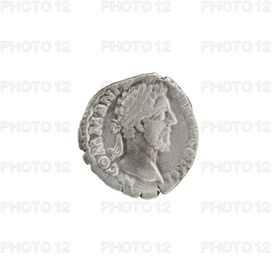 Denarius of Commodus (161–192; Roman emperor 177–192). Obverse: Head of Commodus in laurel wreath facing right, inscription M COMM ANT - FEL AVG BRIT. Reverse: Fortuna seated left holding a rudder in her right hand and a cornucopia in her left, a wheel under the seat, inscription PM TRP XI IM, VII - COS V PP. Episode FOR RED, 186, Rome, Roman Empire (27 BC–476). Coin. Diameter 17.0–18.0 mm, weight 2.15 g, axis 15°.