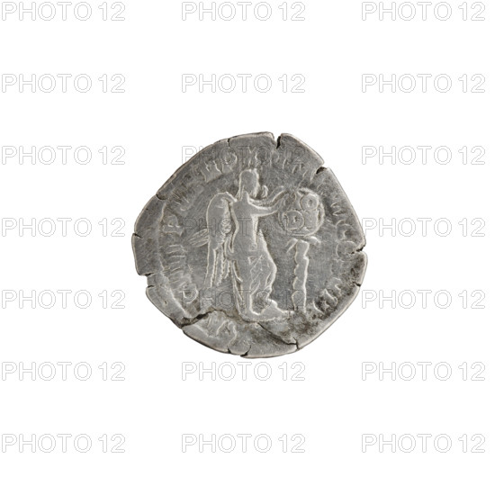 Denarius of Commodus (161–192; Roman emperor 177–192). Obverse: head of Commodus in a laurel wreath to the right, inscribed M·COMM·A·P·FEL·AVG·BRIT around. Reverse: Victoria half-naked, with her foot on a helmet on the ground, stands to the right and attaches a shield inscribed VO/DE to a tree trunk, inscribed SA·C·FEL·PM·TRP·XI·IMP·VII·COS·V·PP around. Roman Empire, Rome; coin. Diameter 17.5–18.5 mm, weight 2.75 g, axis 180°.