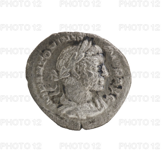 Denarius of Elagabalus (reigned 218–222). Obverse: IMP ANTONINVS PIVS AVG — Bust of Elagabalus in laurel wreath, armor and paludamentum, facing right; pearl border. Reverse: LIBERTAS AVG — Libertas standing facing left, holding a pileus in right hand and a long scepter in left; pearl border. 220–222 CE, Roman Empire. Coin; diameter ~17.0–18.5 mm, weight 2.50 g.