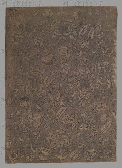 Floral ornament, graphic artist, Lohojsk. Possibly a matrix for embossing leather. Before 1850. Matrix. Height 28.6 cm; width 20.6 cm., A rectangular metal plate with an overall brown and copper tone features an intricate engraved floral pattern covering its surface; a dense background of small etched dots contrasts with flowing vines, stylized leaves, and a variety of flower forms arranged in a repeating ornamental design, with larger decorative cartouche-like floral motifs interspersed among smaller blossoms and buds, and subtle variations of darker brown lines where the engraving cuts the metal.