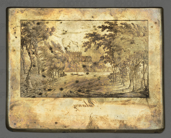Pulawy, Dietrich, Fryderyk Krzysztof (1779–1847), graphic artist; palaces, landscapes, parks (gardens), park landscapes, staffage, hunting (genre scenes), trees, country roads; ca. 1835; graphic matrix/graphic plate; height 10.3 cm, width 12.9 cm., A rectangular metal plate with a framed engraved scene shows a landscape with a group of trees on the left and another group of trees on the right, framing a grassy clearing and a winding dirt path leading toward a distant large building partially obscured by foliage; the engraving lines are dark against a warm golden background with areas of darker brown spots and mottling, and the metal border around the scene shows a patina of muted gold, brown, and hints of greenish gray.