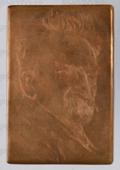 Portrait of Józef Pilsudski, Lopienski, Ignacy (1865–1941), graphic artist; Pilsudski, Józef (1867–1935) — iconography; male portrait; Head turned to the right; 1937; Warsaw, Poland; graphic plate; height 15 cm, width 10 cm, A rectangular metal plate with a warm brown and copper tone fills the image, showing an etched profile of an older man with a mustache and beard; the etching lines are lighter copper against the darker plate. The man is depicted with swept-back hair, a defined ear, and a turned head with visible eyes and facial hair; the etched texture suggests fine lines for hair and beard. The plate has softened rounded corners and a narrow border, and the background around the plate is a pale gray. Several small surface marks and faint scratches are visible on the metal.