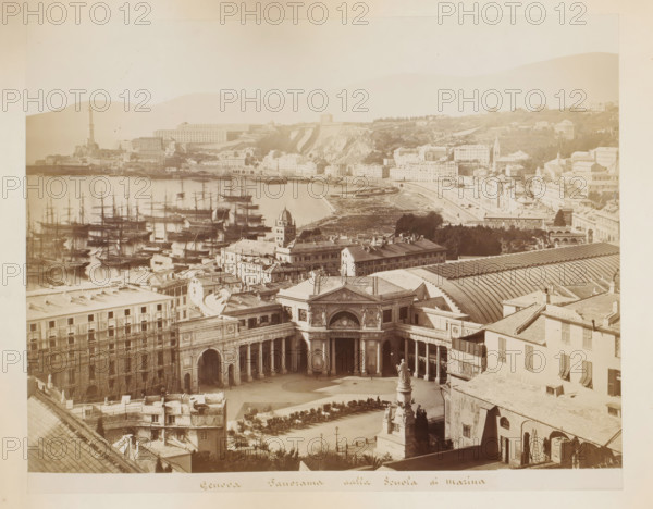 Genova panorama dalla scuola di marina, View of the harbor, the marine school and the station of Genoa, Italy, album page, photograph, This photo is part of an album., Genoa, 1870 - 1890, photographer, paper, albumen print, height 217 mm x width 275 mm, harbor, city-view in general, 'veduta', station, shelter (railway, tramway), A wide coastal cityscape viewed from above showing a semicircular plaza with a grand colonnaded building and a sculpted fountain in front, rows of parked carriages and shaded seating around the square, adjacent multi-story buildings with shuttered windows and tiled roofs, a long arched train shed roof visible behind them, a busy harbor filled with numerous masted sailing ships and reflections on calm water, a promontory with a tall lighthouse and clustered buildings, terraced hills and cliffs rising behind the shoreline, scattered villas and larger buildings on the hillside, tree-lined areas and patches of open ground, and a pale sky above the entire scene.