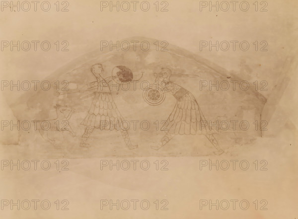 Mural in the Reformed Church in Westerwijtwerd, photograph, annotation: 'Church in Westerwijtwerd, NW view July 1897, municipality of Middelstum', annotation: 'Mural in the Dutch Reformed Church in Westerwijtwerd, Found and whitewashed again in 1897, See Hoogewerff I, p 46-50, photo July 1897, Westerwijtwerd, 1897, photographer, Attributed to, paper, pasteboard, albumen print, height 163 mm x width 222 mm, painting (including book-illumination, miniature-painting) (mural painting), A faded wall scene shows two stylized human figures facing each other, each wearing patterned garments with layered skirt shapes and leg coverings with diagonal markings; the figure on the left holds a long horizontal object and extends an arm toward a circular shield-like form with a darkened semicircular area, while the figure on the right holds a round, concentric shield and has an elongated object projecting from behind the head; two animal figures appear near the lower edges, one near each human, depict...