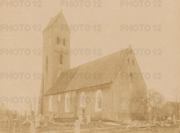 View of the Reformed Church in Midwolde, photograph, annotation: 'Midwolde', annotation: 'Kerk v, d Ned. Rev. avg. in Midwolde, April 1897', Midwolde, 1897, photographer, Attributed to, paper, pasteboard, albumen print, albumendruk, height 164 mm x width 218 mm, churchyard, cemetery, church (exterior), A sepia-toned photograph shows a brick church with a steep tiled roof and a square bell tower topped by a pointed roof, the tower featuring tall arched window openings. The church wall displays a series of tall arched windows and a small doorway, and the gable end has a small circular opening near the roof peak. In front of the church is a graveyard with upright headstones and a fenced plot, and a leafless tree stands near the right side of the building. The scene appears faded and evenly tinted, with soft contrast and visible texture on the brickwork and roof tiles.