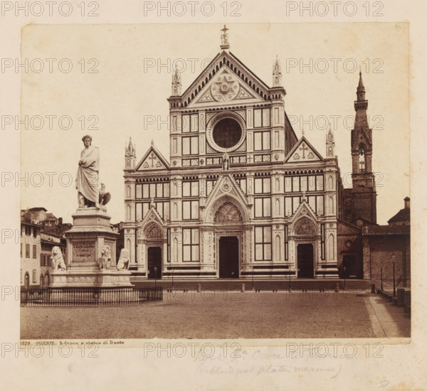 Santa Croce with a statue of Dante in front of it in Florence, FIRENZE. S. Croce e statua di Dante, photograph, number: '1829.', Florence, c. 1875 - c. 1900, photographer, Tuscany, paper, pasteboard, albumen print, height 202 mm x width 245 mm, monument, statue, church (exterior), Santa Croce, A sepia photograph of a large ornate church facade with geometric patterned panels, arched doorways, decorative triangular gables, and a large circular window above the central entrance, flanked by tall narrow towers and a taller steeple to the right; in front of the church on the left stands a statue of a robed figure on a pedestal guarded by sculpted lions and surrounded by a low fence, with rows of steps and a paved open square in the foreground.