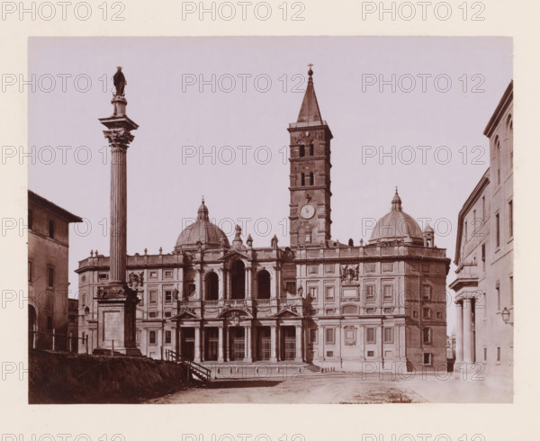 Basilica di SM Maggiore, View of the Basilica of Santa Maria Maggiore in Rome, Italy, Roma, photograph, inscription: 'Roma, SM Maggiore', number: '3649.', number: '51', photographer: Giacomo Brogi (possibly), Rome, publisher: attributed to Edizioni Brogi, Florence, 1864 - 1881, Tuscany, Attributed to, pasteboard, paper, albumen print, height 317 mm x width 450 mm, church (exterior), column, pillar, architecture, Santa Maria Maggiore (Rome), A wide stone façade with columns, arches, decorative sculptures, and two domes sits behind a plaza, flanked by tall buildings on either side; a tall fluted column topped with a statue rises in the foreground to the left, and a square bell tower with arched openings and a pointed roof topped by a cross rises above the central part of the façade; steps lead up to a portico with multiple entrances, and sculpted figures and ornamental balustrades line the roofline and pediments.