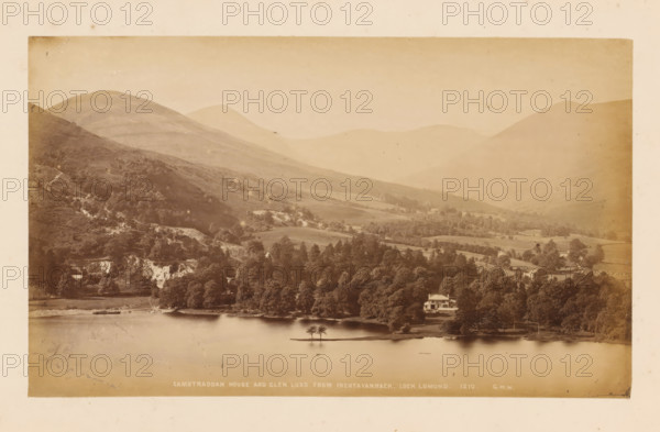 View of Loch Lomond, Glen Luss and Camstraddan House, Camstraddan House and Glen Luss from Inchtavannach, Loch Lomond, photograph, number: '1207, GWW', photographer: George Washington Wilson, Scotland, 1865 - 1880, paper, albumen print, height 116 mm x width 192 mm, landscapes with waters, waterscapes, seascapes (in the temperate zone), dale, valley, A wide sepia-toned landscape showing a calm body of water in the foreground with a small island holding a few trees near its center, a shoreline lined with dense trees and a light-colored house partially visible among the trees, rolling grassy hills rising behind the tree line, steeper wooded slopes and rocky outcrops on the nearer hills, and distant layered mountain ridges fading into the sky.