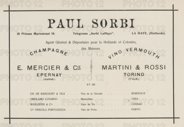 Advertisement for Paul Sorbi, album page, This page is part of an album., Netherlands, in or after 1908, paper, printing, height 240 mm x width 324 mm, advertising, The image shows a vintage printed document with a cream-colored background and a thin black border near the edges, divided by vertical and horizontal rules; large bold decorative headings appear centered at the top, with smaller lines of printed information beneath and curved words arcing above two central columns; the left and right halves each feature bold block names in large dark type, with smaller parenthetical words beneath them, and a narrow vertical ornamental divider sits between the columns; below these columns is a list of entries aligned in rows with dotted leader lines extending toward the right column, and the whole page has small spots and slight discoloration consistent with aged paper.