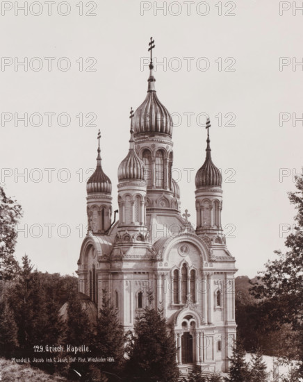 Greek Chapel', Russian Orthodox Church on Mount Nero, Wiesbaden, Germany, photograph, Erroneously named 'Greek Chapel' Russian Orthodox church 'of Saint Elisabeth in Wiesbaden', which Adolf von Nassau had built between 1847-1855 as a tomb for his young deceased wife Elisabeta Mikhailovna (daughter of the younger brother of Tsars Alexander I and Nicholas I of Russia)., inscription: 'Mondel & Jacob Inh. G. Jacob, Hof-Phot. Wiesbaden 1896.', inscription: '129. Griech. Kapelle', photographer: Mondel & Jacob, photographer: Mondel, photographer: Julius Jacob, 1896, Mondel & Jacob, Mondel, Julius Jacob, photographer, Hessen, pasteboard, paper, gelatin silver print, developing gelatin silver print, height 282 mm, width 225 mm x width 330 mm, height 508 mm, A large ornate church building with multiple onion-shaped domes topped by crosses rises above surrounding trees, showing detailed stonework, arched windows, columns, decorative carvings, and a grand arched entrance with steps; trees frame th...