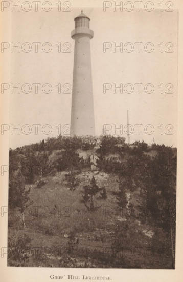 Gibbs' Hill Lighthouse, page, photomechanical print, photographer: James H. Stark, Bermuda, cliché maker: Photo-Electrotype Company, Boston (Massachusetts), c. 1879 - in or before 1884, James H. Stark, Photo-Electrotype Company, photographer, cliché maker, North America, Massachusetts, paper, collotype, photoprint, height 151 mm x width 90 mm, lighthouse, lightship, Gibbs Hill Lighthouse, A tall cylindrical lighthouse rises from behind a sand dune covered in low, scrubby vegetation, its smooth shaft tapering slightly toward a lantern room with vertical window panels and a domed roof; in front of the lighthouse the dune slopes down with scattered grasses and small bushes, and a thin pole with supporting guy wires stands near the base of the tower.