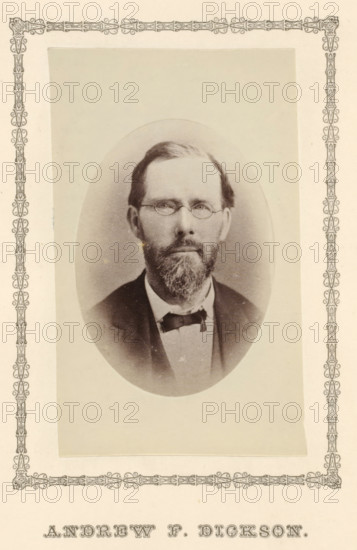Andrew F. Dickson, photograph, page, c. 1876 - in or before 1881, photographer, paper, albumen print, height 99 mm x width 59 mm, adult man, A sepia-toned oval portrait of a man with a beard and mustache wearing round spectacles and a dark jacket over a light shirt with a bow tie, mounted on a rectangular paper with a decorative border.