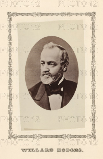 Willard Hodges, photograph, page, c. 1876 - in or before 1881, photographer, paper, albumen print, height 99 mm x width 58 mm, Person, politician, eg party leader, A sepia-toned oval portrait of a middle-aged man with a short beard and mustache, wearing a dark suit jacket and bow tie, set on a lighter rectangular backing that is slightly tilted within an ornate decorative border on a cream-colored background.