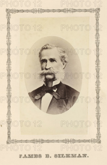 James B. Silkman, photograph, page, c. 1876 - in or before 1881, photographer, paper, albumen print, height 100 mm x width 58 mm, adult man, An oval black-and-white portrait of an older man with a full mustache and sideburns, wearing a dark suit jacket, a white shirt, and a bow at the collar, mounted on a pale rectangular background with a decorative ornate border around the page.
