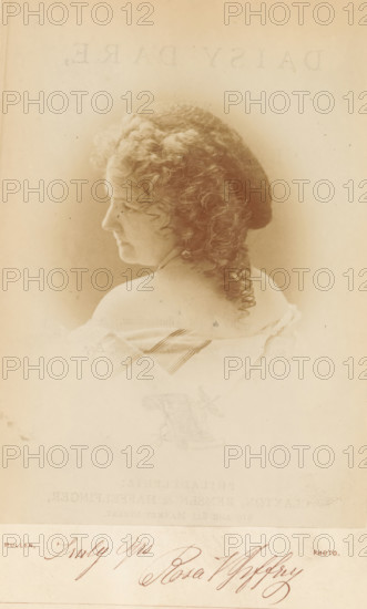 Portrait of Rosa Vertner Jeffrey, photograph, page, inscription: 'Yours truly Rosa Jeffrey', photographer: Mullen, c. 1866 - in or before 1871, paper, albumen print, height 142 mm x width 101 mm, Photo on frontispiece., Person, Rosa Vertner Jeffrey, writer, poet, author, Sepia-toned portrait of a woman shown in profile facing left, with curly hair gathered at the back and a long curled lock falling down her neck, bare shoulders revealed by an off-the-shoulder garment with faint striped detailing, soft lighting creating a vignette around her head and shoulders, and a lighter lower area with a handwritten signature visible at the bottom.