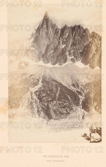 The Aiguille du Dru, Photograph, page, inscription: '(from Montanvert)', photographer: Stephen Thompson, c. 1863 - in or before 1868, paper, albumen print, height 186 mm x width 125 mm, mountain-range, snow peaks, Aiguille du Dru, A sepia-toned photograph of a rugged mountain peak with steep, jagged rock faces and patches of snow on its slopes, a broad talus or scree field at the base of the cliffs, rocky outcrops and ridges extending downwards, and a small tree with sparse foliage visible near the lower right edge of the framed image.