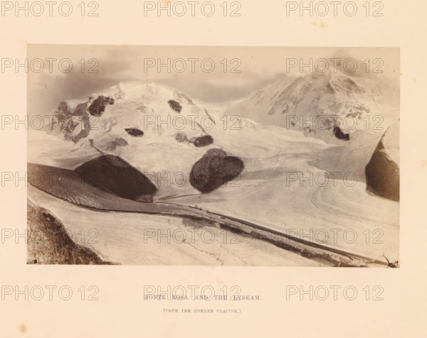 View of Monte Rosa, Monte Rosa and the Lyskam, photograph, page, inscription: '(from the corner glacier)', photographer: Stephen Thompson, Monte Rosa, c. 1863 - in or before 1868, paper, albumen print, height 102 mm x width 172 mm, mountain-range, snow peaks, glacier, A sepia-toned photograph showing a snowy mountain landscape with large snowfields and glaciers stretching across the scene, jagged rocky peaks rising in the background partially shrouded by cloud and mist, several dark exposed rock outcrops protruding from the snow, smooth curving snow ridges and crevasses in the foreground, a dark narrow moraine or trench cutting across the lower area, and a pale border surrounding the image.