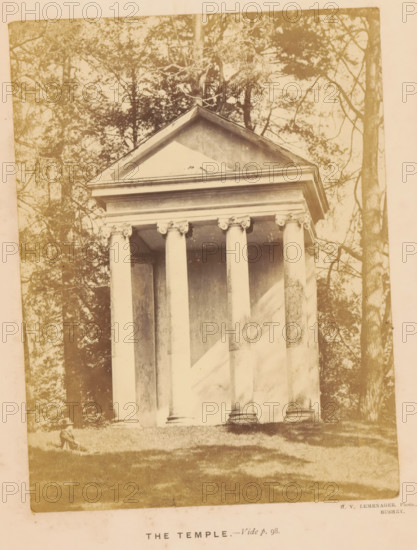 View of a small temple in Moor Park in Rickmansworth, The Temple, photograph, page, inscription: 'Vide p. 98.', photographer: Henri Victor Leménager, Rickmansworth, c. 1866 - in or before 1871, Hertfordshire, paper, albumen print, height 136 mm x width 102 mm, park, temple, shrine, Roman religion, A sepia-toned photograph showing a classical temple facade with a triangular pediment and a horizontal entablature supported by tall fluted columns with ornate capitals, set against a background of tall trees and foliage; grass covers the foreground and a person wearing a hat and seated on the grass appears near the left corner of the building.