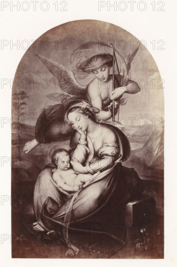 Photo reproduction of The Sleeping Christ Child by Antoine Wiertz, photograph, reproduction, page, check stamp: 'SOCIÉTÉ ROYALE BELGE DE PHOTOGRAPHIE, 69, RUE KEYENVELD, BRUXELLES', photographer: Edmond Fierlants, after painting by Antoine Joseph Wiertz, c. 1863 - in or before 1868, paper, albumen print, albumendruk, height 177 mm x width 114 mm, Christ-child sleeping, Madonna-representations, A sepia-toned arched image shows a seated woman with downcast eyes and a serene expression holding a sleeping infant in her lap, the woman wearing flowing drapery and a headscarf, her hand supporting the child's head while the child's body is partially wrapped in cloth and a faint halo surrounds the infant's head; behind them an angel with wings leans forward, gazing downward and holding a slender staff, the angel's hair and translucent drapery billow around the shoulders; a distant landscape with rolling hills and a pale round sun or moon appears in the background, and at the lower right a small...