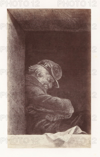 Photo reproduction of The Caretaker by Antoine Wiertz, photograph, reproduction, page, check stamp: 'SOCIÉTÉ ROYALE BELGE DE PHOTOGRAPHIE, 69, RUE KEYENVELD, BRUXELLES', photographer: Edmond Fierlants, after painting by Antoine Joseph Wiertz, c. 1863 - in or before 1868, paper, albumen print, albumendruk, height 169 mm x width 101 mm, adult man, sleeping in chair, A framed rectangular scene with a dark interior and a lighter border showing a seated figure in profile leaning forward. The figure has a pale, textured face with visible hair and wears a rounded hat with decorative banding; the head is tilted downward. The figure is clothed in a heavy, textured garment with folds and visible armrests or crossed arms. A ledge or table in the foreground holds a folded sheet of paper with a folded corner, casting a faint shadow. The left side shows a vertical column or wall with rough texture meeting the dark background. The image is rendered in muted monochrome tones with visible grain and sha...