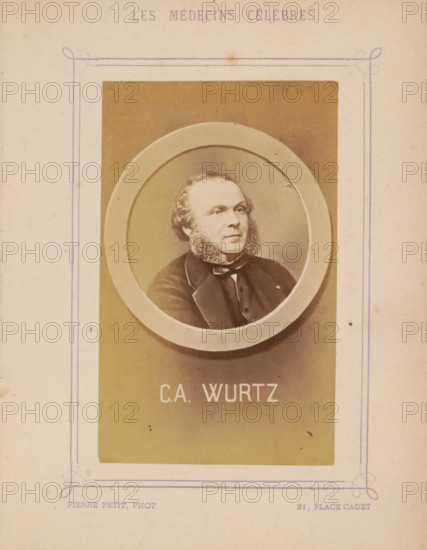 Portrait of Charles-Adolphe Wurtz, photograph, page, inscription: '(Publication de la Revue de literary médicale du, DF Bremond, 5 Rue Beudant, Paris. No.', photographer: Pierre Petit, c. 1871 - c. 1879, paper, albumen print, height 91 mm x width 56 mm, Person, Charles-Adolphe Wurtz, historical persons, adult man, A faded sepia portrait of a man with sideburns framed inside an oval mat, set against a rectangular background area on aged paper with decorative purple line borders and faint stains.