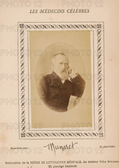 Portrait of an unknown man, photograph, page, annotation: 'Munaret', inscription: '(Publication de la Revue de literary médicale, du docteur Félix Bremond, 20, Passage Saulnier, Paris., e année - No.', number: '70', photographer: Pierre Petit, c. 1871 - c. 1879, paper, albumen print, height 82 mm x width 51 mm, historical persons, adult man, A sepia-toned portrait of an older man with a beard sitting with one hand resting against his cheek inside an oval frame, set within a decorative rectangular border with leaf-like patterns at the corners and along the sides, all printed on aged paper with faint spots and discoloration.