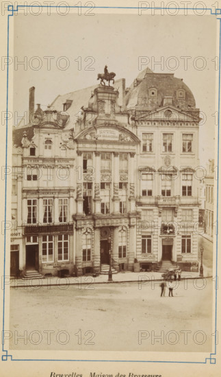 View of the Brewers' House in Brussels, Bruxelles. Maison de Brasseurs, photograph, page, Brussels, c. 1875 - c. 1880, photographer, paper, albumen print, height 170 mm x width 102 mm, street (city(-scape) with figures, staffage), façade (of house or building), A sepia-toned photograph of an ornate row of multi-story stone buildings with decorative facades and tall windows, the central building featuring large columns, sculpted ornamentation, and an arched entrance topped by an equestrian statue on its roof; adjacent buildings show varied rooflines, dormer windows, and sculpted detailing, with storefronts and entrances at street level, window curtains visible in some windows, and awnings over lower windows; a cobbled street runs in front of the buildings, where a few people stand together near a small cart and a lamppost, and additional lampposts are positioned along the sidewalk.