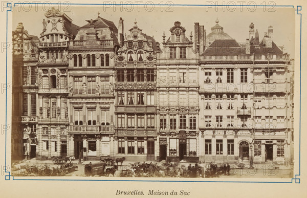 Brussels. Maison du Sac, View of the house Den Sack in Brussels, photograph, page, Brussels, c. 1875 - c. 1880, photographer, paper, albumen print, height 103 mm x width 172 mm, street (city(-scape) with figures, staffage), façade (of house or building), A row of ornate, multi-story stone buildings with detailed façades featuring decorative sculptures, balustrades, arched windows, and carved ornamentation; several buildings have tall narrow windows with curtains, small balconies, and sculpted figures integrated into the architecture; rooftop elements include chimneys, dormer windows, and ornate gables with rounded and triangular shapes; at street level there are doorways, shopfronts with display windows, and entrances topped by decorative lintels; horse-drawn carts and horses are positioned along the street in front of the buildings, with a few indistinct figures near them; the photograph is framed by a light border with a thin decorative inner line.