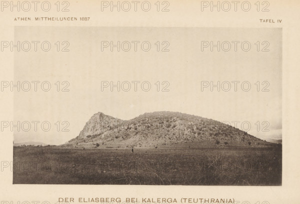 View of a mountain, Der Eliasberg bei Kalerga (Teuthrania), page, photomechanical print, inscription: 'Athen Mittheilungen 1887 Tafel IV', c. 1881 - in or before 1886, paper, collotype, photoprint, height 101 mm x width 179 mm, Print two pages after page 148., mountains, A sepia-toned photograph showing a gently sloping rocky hill with a steeper craggy peak on one side, covered in patches of low vegetation and scattered shrubs; a flat open plain in the foreground with sparse grassy growth and a solitary small figure standing near the center, and a pale sky above occupying most of the upper area.