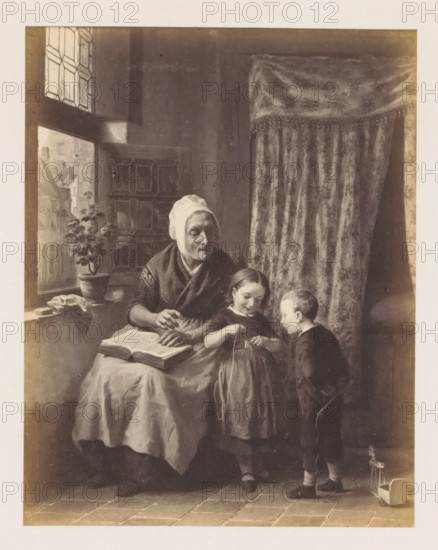 Photo reproduction of La leçon sollicitée by de Bruycker, photograph, reproduction, page, after painting by François Antoine De Bruycker, c. 1858 - c. 1863, photographer, paper, albumen print, albumendruk, height 152 mm x width 119 mm, picture, painting, old woman, education, science and learning, An interior scene shows an older woman seated by a window with a patterned curtain behind her, wearing a head covering and shawl, holding a book open on her lap and looking toward two children; a girl stands beside her holding a stringed object and smiling downward, and a boy stands facing the girl holding a small stick, with a toy on wheels near his feet; the window has leaded panes and a potted plant sits on the sill, a cloth draped nearby, and the floor is tiled.