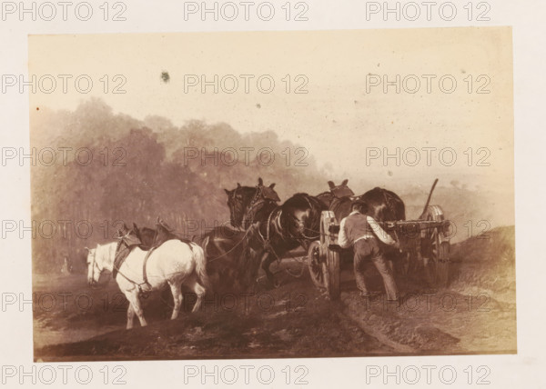 Photo reproduction of L'Attelage by Edmond Tschaggeny, photograph, reproduction, page, after painting by Charles Tschaggeny, c. 1858 - in or before 1863, Charles Tschaggeny, photographer, after painting by, paper, albumen print, albumendruk, height 108 mm x width 159 mm, picture, painting, horse, four-wheeled vehicle drawn by more than three animals, A sepia-toned scene shows several horses harnessed to a wooden wagon on a dirt path with a man leaning into the wagon from behind; the horses include a lighter-colored one at the left and darker ones toward the center and right, all wearing bridles and harnesses, and the wagon has large wooden wheels and a long handle; a misty tree line fills the background and the sky above is pale with scattered dark spots.